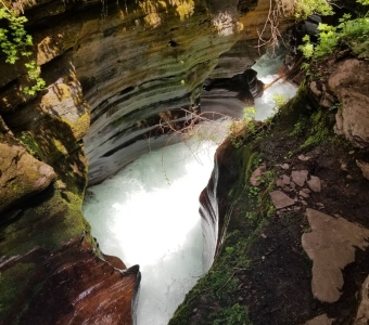 Bear Creek rushing through the sculpted rock grotto at Little Hawaii near Telluride, Colorado