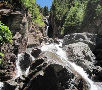 Ballard Falls cascading over boulders in Bear Creek Canyon near Telluride, Colorado