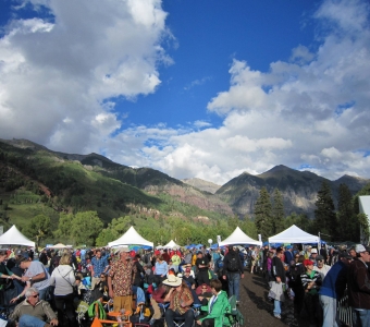 Telluride Blues & Brews Festival crowd beneath the Telluride box canyon
