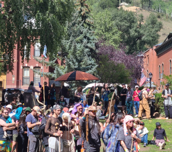 Crowd carrying sticks during the Camp Alderwild 2026 stick tournament in Telluride
