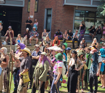 Camp Alderwild festivalgoers gathered with sticks during the 2026 Elks Park stick tournament