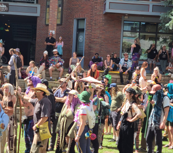 Camp Alderwild festivalgoers carrying sticks during the stick tournament in Elks Park in Telluride