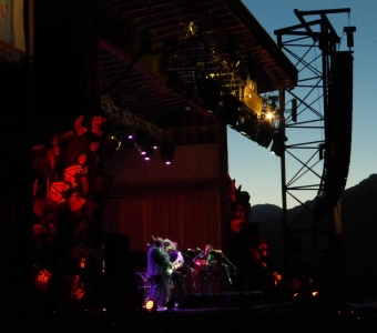 Musicians performing at the Telluride Bluegrass Festival in Town Park at dusk
