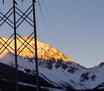 Winter moon and alpenglow above Ophir Pass near Ophir, Colorado