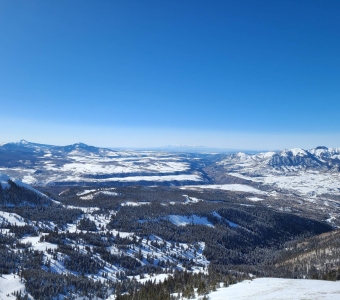 View from the Gold Hill ridgeline across Prospect Basin, with Utah’s La Sal Mountains visible on the distant horizon.