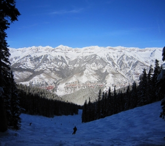 Skier entering Mammoth from one of the upper Mammoth fingers at Telluride Ski Resort.