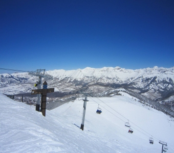 Top of Revelation Bowl, with the Gold Hill Express upper terminal visible in the distance at Telluride Ski Resort.