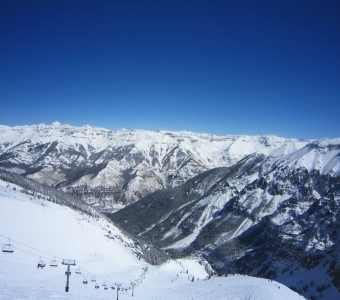 Looking down Revelation Bowl and the Revelation Lift at Telluride Ski Resort, with the San Juan Mountains beyond.