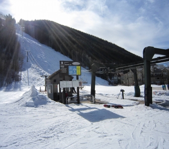 Base of the Coonskin Lift 7 with the steep Coonskin run rising above Telluride.
