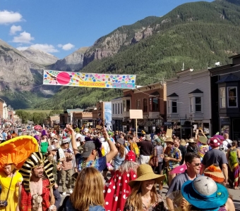 Telluride Mushroom Festival parade fills Colorado Avenue with mushroom costumes in downtown Telluride.