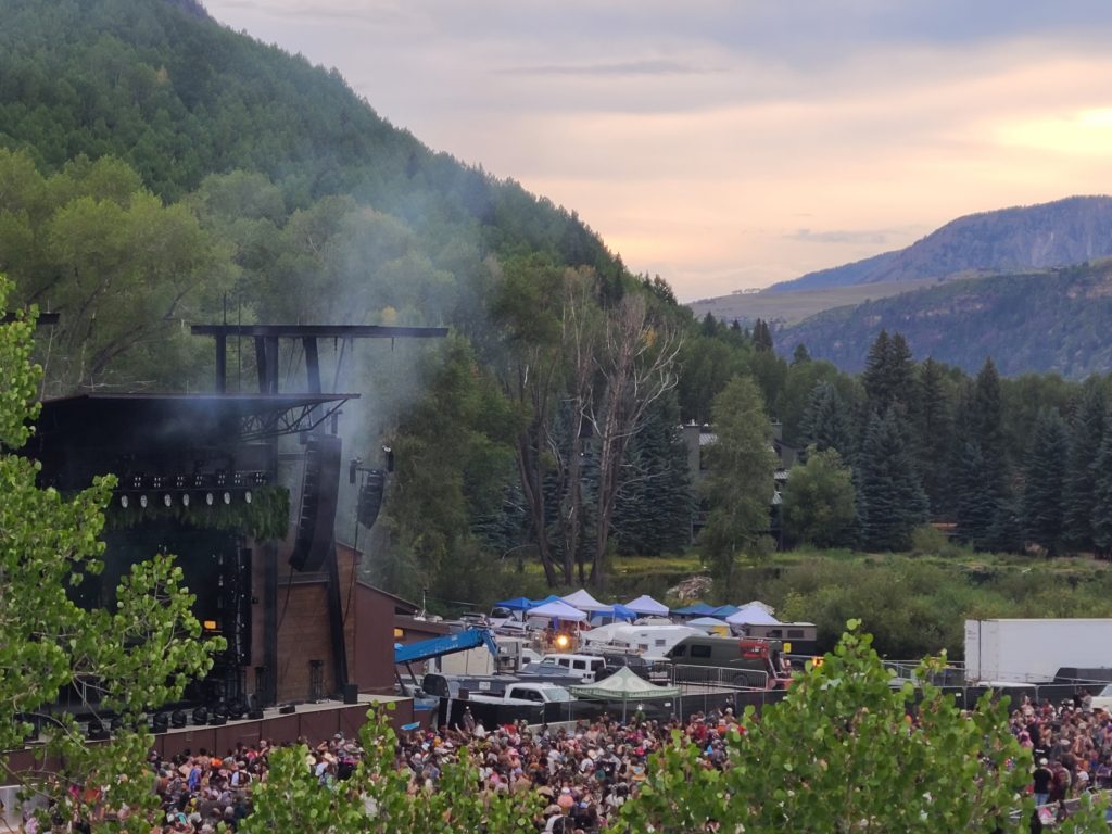 Camp Alderwild 2026 stage and crowd in Telluride Town Park viewed from Firecracker Hill
