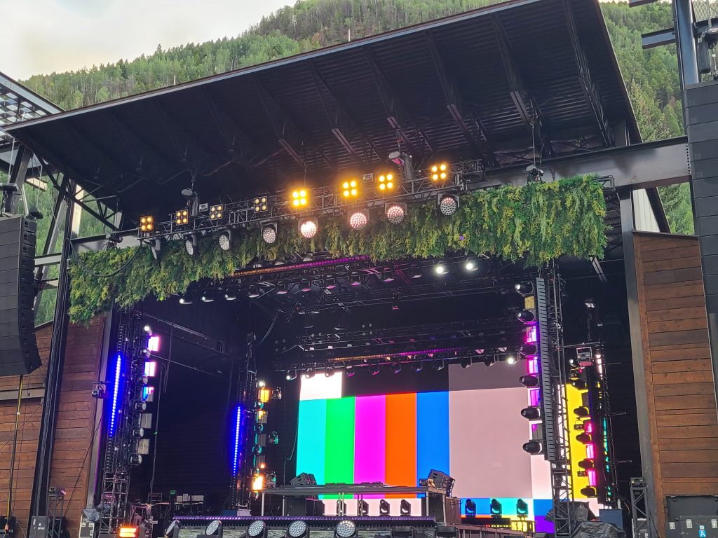 Camp Alderwild 2026 stage lighting and video screens during setup in Telluride Town Park