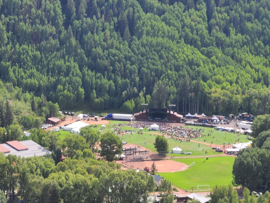Camp Alderwild 2026 in Telluride Town Park viewed from Tomboy Road across the valley shortly after Saturday's music began.